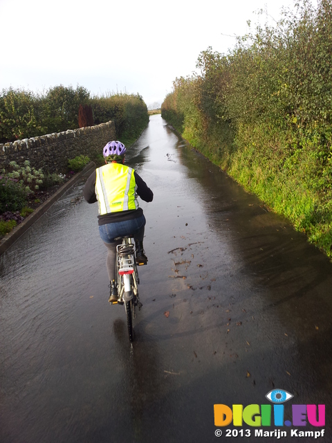 20131109_135049 Jenni cycling through river on road